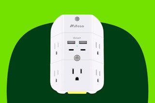 A surge protector has two AC outlets on each side, 4 USB ports and one AC outlet in the front, and a dusk-to-dawn night light on the bottom.