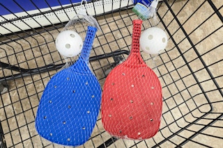 kids pickleball sets in a cart