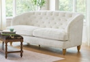 white tufted sofa