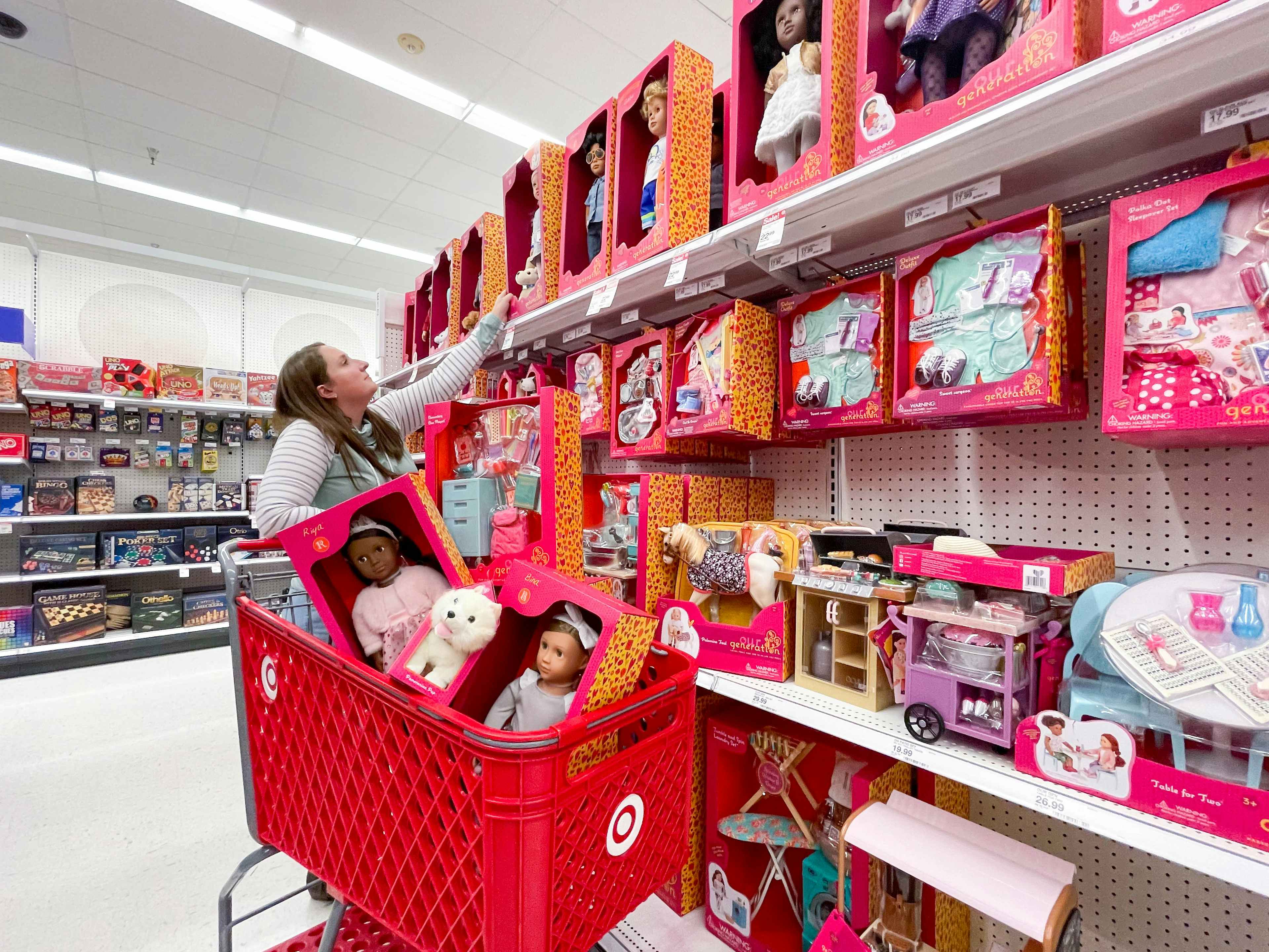 woman shopping for dolls and filling up target cart