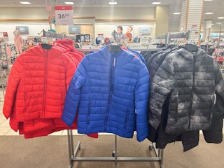 kids puffer jackets on racks