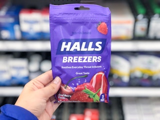 hand holding halls throat drops at target
