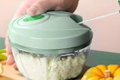 a person using a vegetable chopper