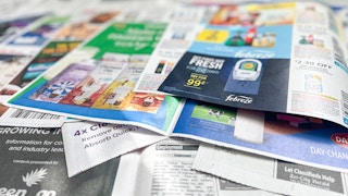 coupon inserts in a pile from the sunday newspaper