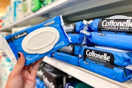hand holding a pack of cottonelle wet wipes at target