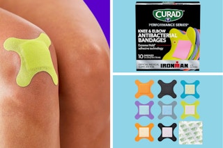 A knee with a bright yellow Curad bandage, a box of Curad, individual bandages out of the box