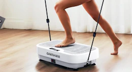 a person exercising on a vibration plate 