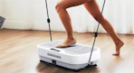a person exercising on a vibration plate