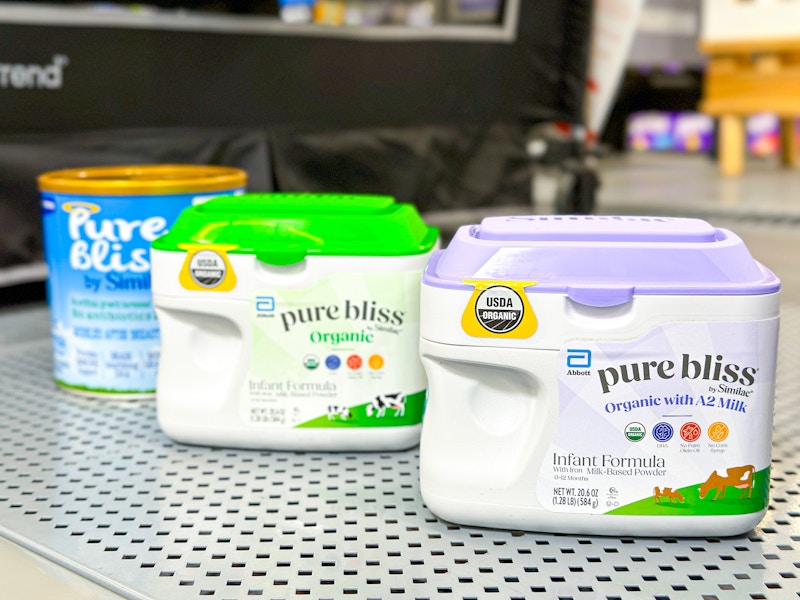 three similac pure bliss containers on walmart shelf