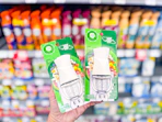 hand holding two Air Wick diffusers