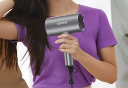 person using the ionic hair dryer