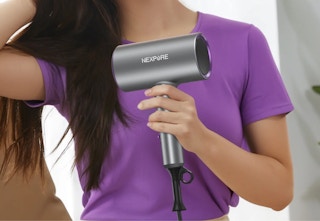 person using the ionic hair dryer