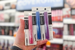 hand holding covergirl remarkable mascaras in walgreens