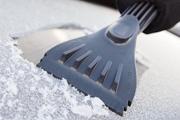 an ice scraper on a car