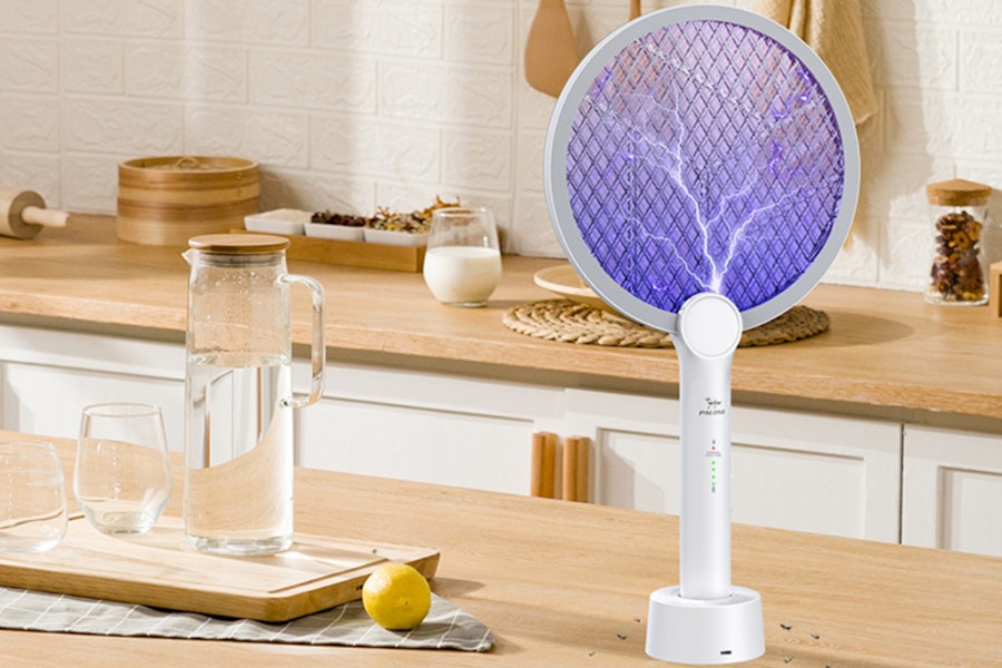 an electric fly swatter on a table
