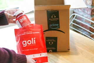 goli apple cider vinegar package being held out of amazon box