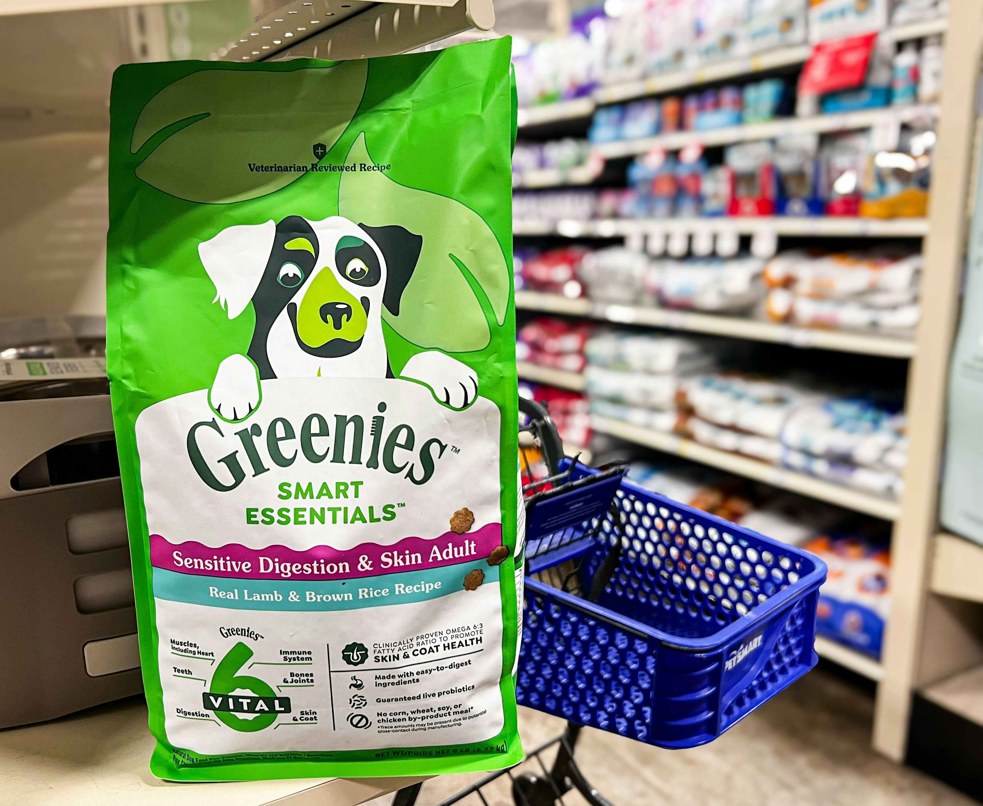 bag of greenies dog food on a shelf with a petsmart cart behind it