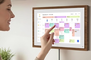 a woman using a digital calendar