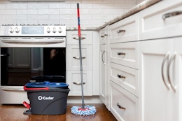 a mop and bucket in a kitchen