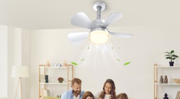 a family sitting under a ceiling fan with a light 