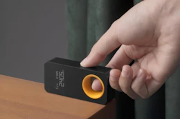 a man using a laser measuring tool