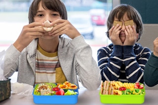 Kids eating out of their bento lunch box