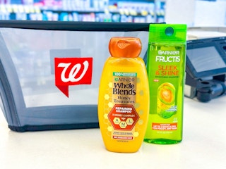 two bottles of garnier hair care next to a walgreens basket