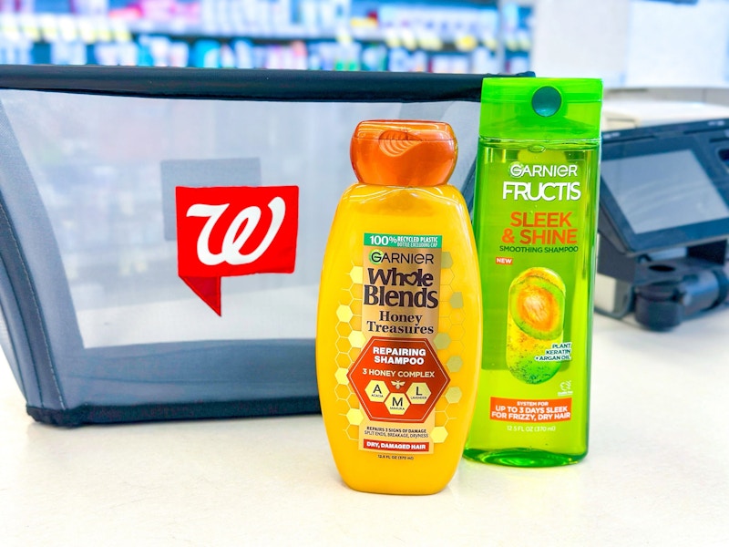two bottles of garnier hair care next to a walgreens basket