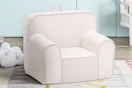Lifestyle image of a pink Olive & Opie Kuddiez Kids Chair in home setting