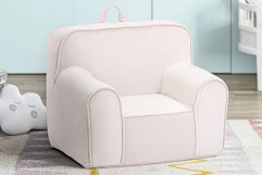 Lifestyle image of a pink Olive & Opie Kuddiez Kids Chair in home setting