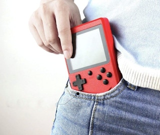 someone putting a video game console in their pocket