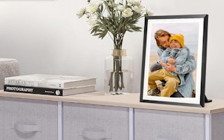 a digital picture frame on a dresser