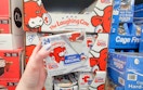 hand holding a pack of laughing cow cheese