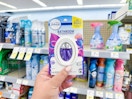 hand holding febreze small spaces in store