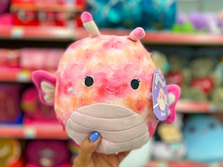 Someone holding up an Easter Squishmallow in Walgreens