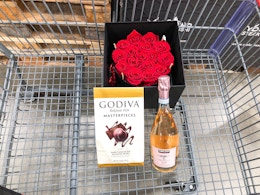 forever roses, godiva chocolates, and rose in a cart