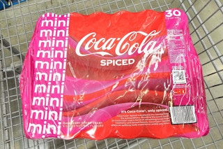 30-pack of coca cola spiced mini cans in a cart