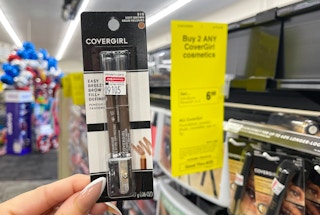 hand holding covergirl brow pencils