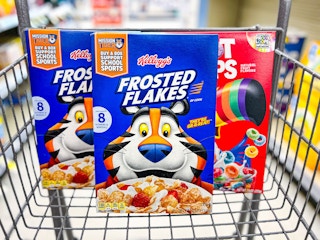 two boxes of frosted flakes and one box of fruit loops in cart