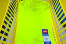 hanes t-shirt folded in a dollar general shopping basket