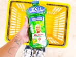 hand holding a bottle of mr. clean multi-surface cleaner