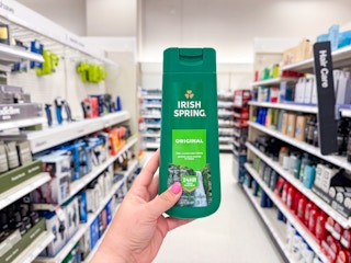 hand holding an irish spring body wash bottle in a target aisle