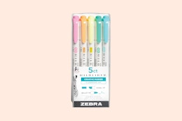 zebra highlighters on a pink background