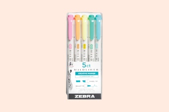 zebra highlighters on a pink background