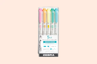 zebra highlighters on a pink background