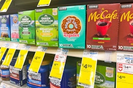 boxes of kcups on a shelf with $4.99 sale tags