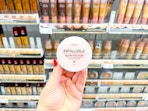 hand holding loreal blur-fection powder in walgreens