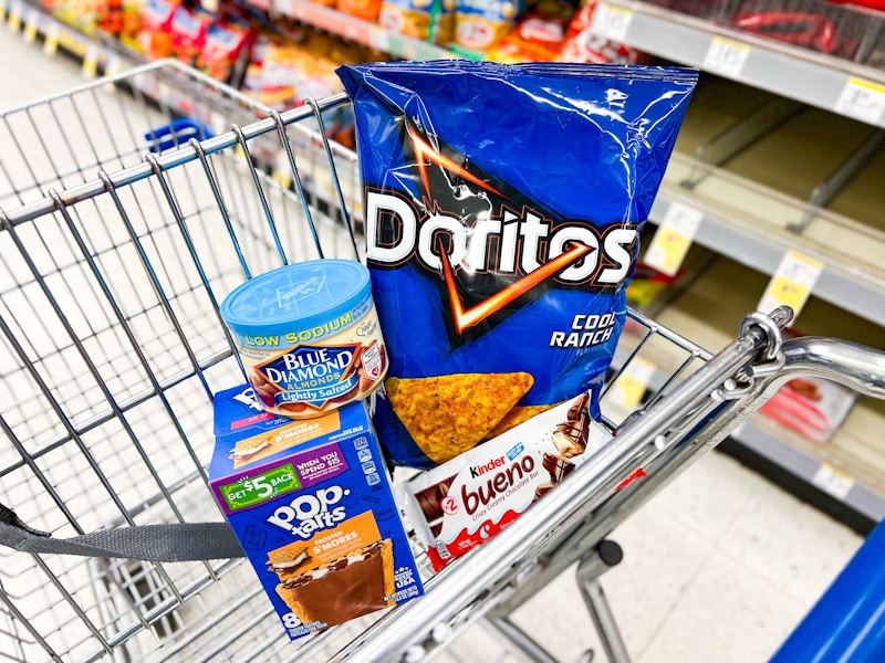 doritos, pop tarts, almonds, and kinder bar in a cart