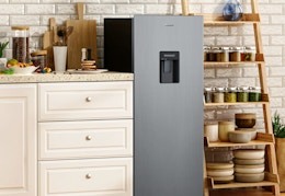 small fridge in a kitchen area