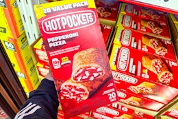 hand holding a box of hot pockets